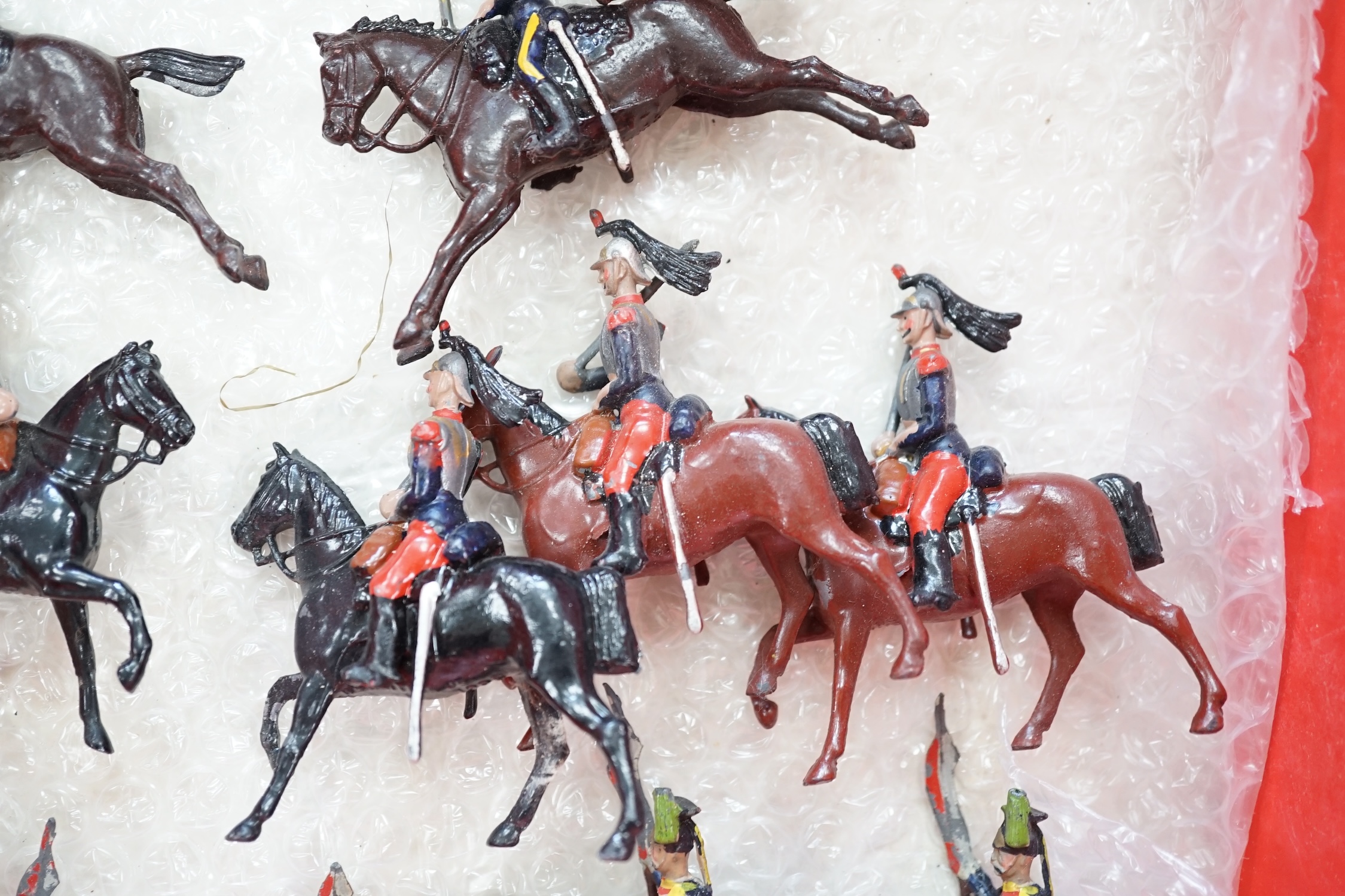 Twenty-six early twentieth century Britains, etc. cavalry soldiers including; fifteen Hussars, Indian cavalry, Royal Lancers, etc.